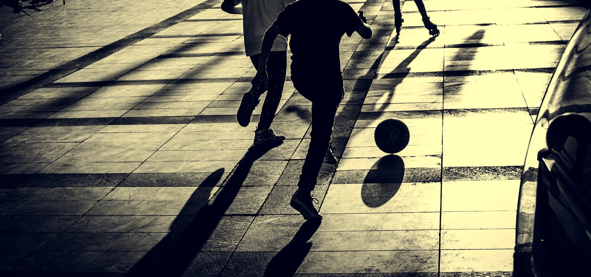 Children running together at golden hour